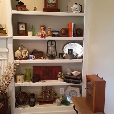 Mantel clock, oil lantern, ship model, curio shelf decor