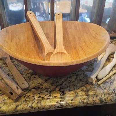 Bamboo salad bowl with servers, wood utensils