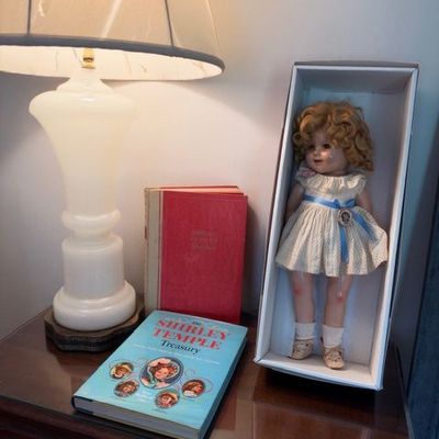 Vintage doll in display box, white table lamp