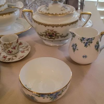 Floral porcelain sugar bowl, creamer, demitasse cup
