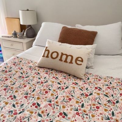 Floral quilt bedding with decorative pillows