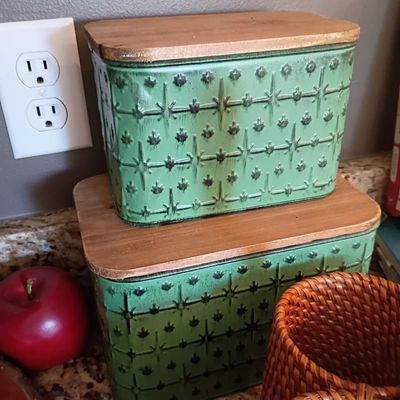 Green embossed metal canisters with bamboo lids