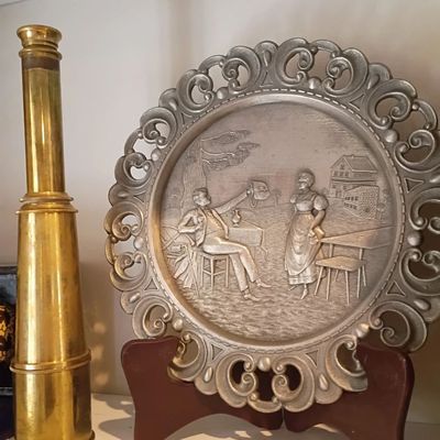 Brass telescope, pewter tavern scene plate