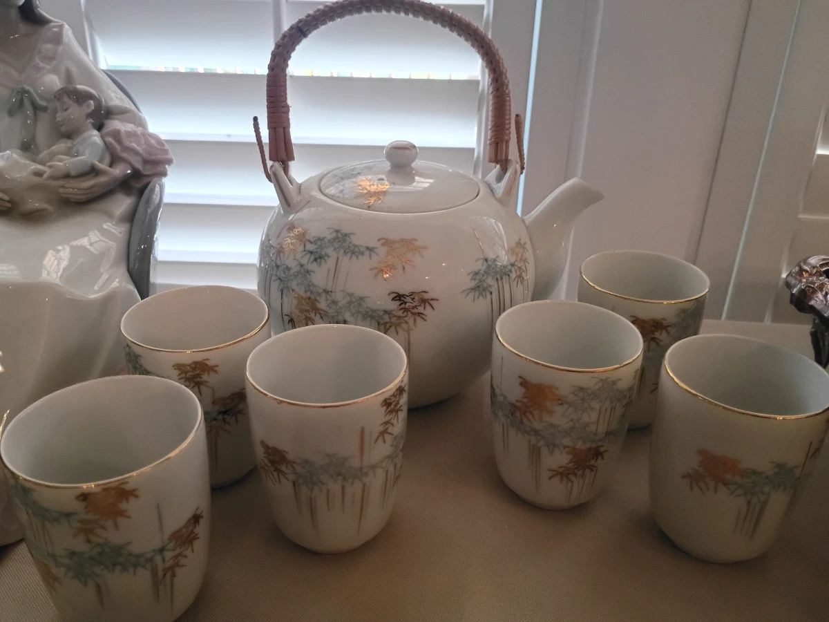 Hand-painted porcelain tea set with cups