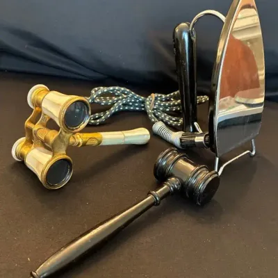 Relics of the past - Vintage travel Iron, opera binoculars and court gavel