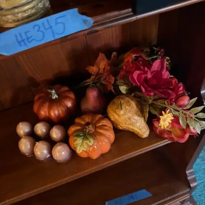 Festive fall décor lot featuring assorted decorative pumpkins and gourds, a ceramic-style orange pum
