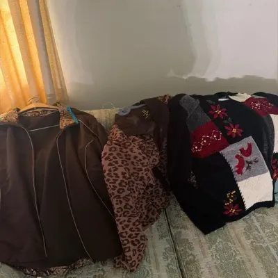 Women’s assorted winter outerwear lot featuring 3 coats/jackets, including a teal winter jacket with