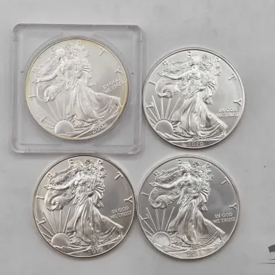 Sale Photo Thumbnail #92: 2122 4 2002 2020 american silver eagle dollars
