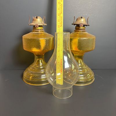 LOT 99: Vintage Amber Oil Lamps w/1 Oil Lamp Chimney