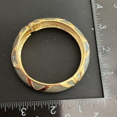 Sale Photo Thumbnail #151: Beautiful Gold Tone gray enamel Hinged Bracelet 
Please see attached pictures