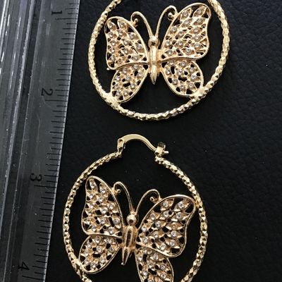 Gold tone butterfly hoop earrings