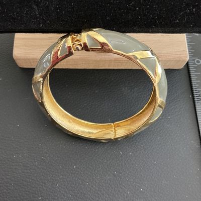 Sale Photo Thumbnail #150: Beautiful Gold Tone gray enamel Hinged Bracelet 
Please see attached pictures