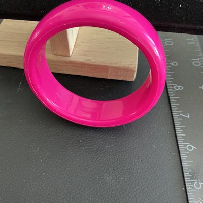Sale Photo Thumbnail #171: Vintage hot pink lucite type plastic bangle bracelet 
Please see attached pictures