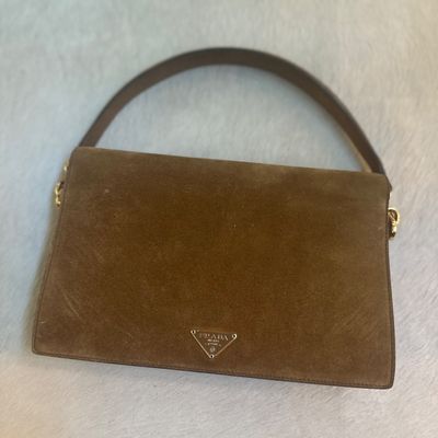 Prada brown suede shoulder bag featuring a structured rectangular silhouette, single leather strap, and the signature triangle logo...