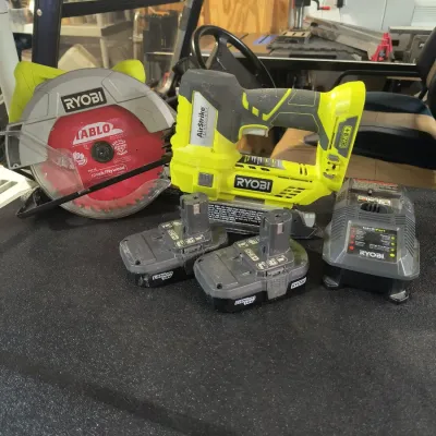 Ryobi ONE+ 18V cordless power tool set, including a circular saw with a Diablo blade, an AirStrike brad nailer, two lithium-ion...