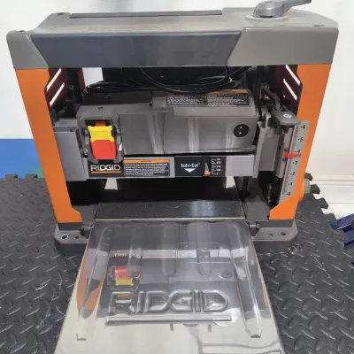 Ridgid portable thickness planer, model R4331, featuring a three-blade cutter head and Ind-I-Cut depth gauge, in clean, gently used...