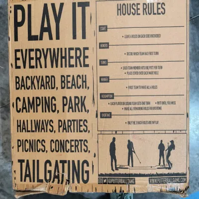 PutterBall backyard golf game in its original cardboard box, showing game rules and illustrations.