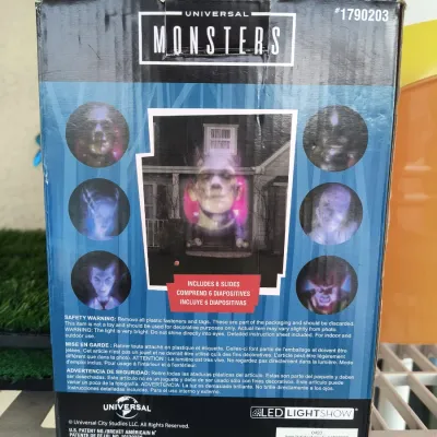 Back of a Universal Monsters LED Lightshow projector box by Gemmy, featuring six included slides of classic horror characters.