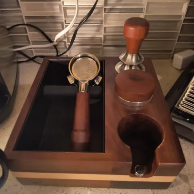 Wooden espresso tamping station and knock box organizer, featuring a matching wood-handled portafilter, tamper, and distributor.