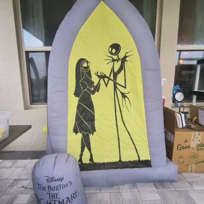Disney Tim Burton's The Nightmare Before Christmas inflatable Halloween decoration, featuring Jack Skellington and Sally in a gothic...