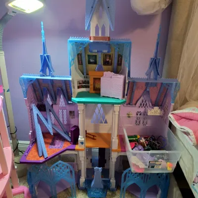 Disney Frozen Ultimate Arendelle Castle dollhouse, featuring multiple levels, rooms, and accessories.
