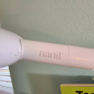 Nanit baby monitor wall mount arm, shown in clean, gently used condition.