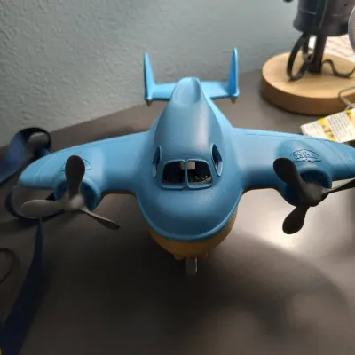 Green Toys blue and yellow plastic toy airplane with dual propellers, in gently used condition.