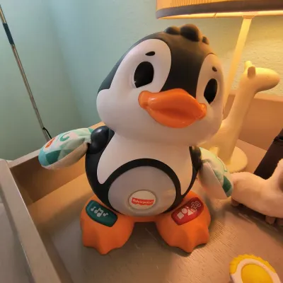 Fisher-Price Linkimals Cool Beats Penguin interactive musical toy, featuring colorful lights, songs, and phrases.