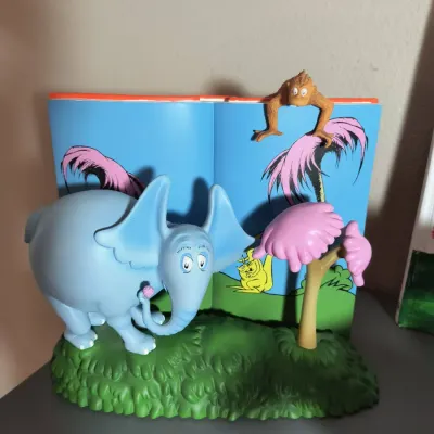 Dr. Seuss "Horton Hears a Who!" collectible figurine featuring Horton the elephant holding a clover, a Wickersham brother...
