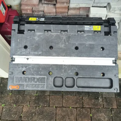 Worx Pegasus folding work table and miter saw stand, showing some light wear from use.