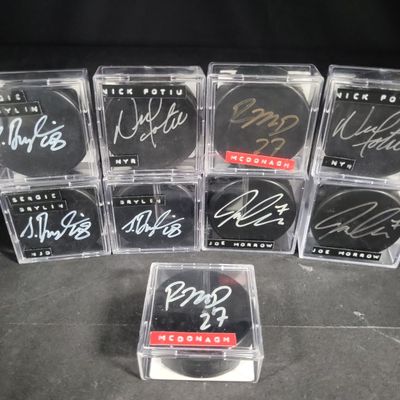 Sale Photo Thumbnail #685: I04369 | Nine SGC Authenticated Signed Hockey Pucks