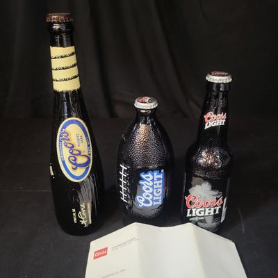 Sale Photo Thumbnail #778: I03053 | A Trio of Coors Brewing Company Commemorative Sports Themed Specialty Bottles