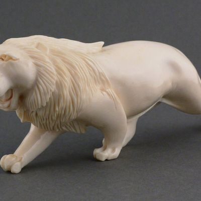 Sale Photo Thumbnail #176: African Carved Ivory Lion Figure