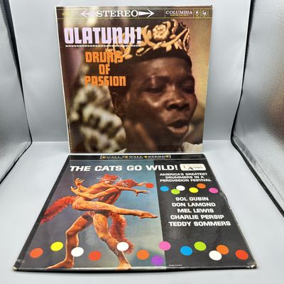 2 LP Lot: Michael Olatunji: Olatunji! Drums Of Passion (unknown press date); and The Cats Go Wild! - America's Greatest Drummers In...