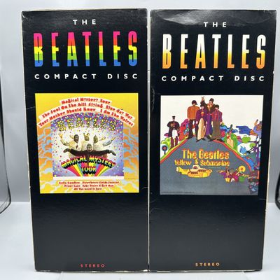 The Beatles (2 Longbox CDs) - Magical Mystery Tour, remastered; and Yellow Submarine, reissue.  Both boxes initially opened from bottom...