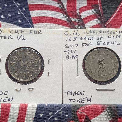 Sale Photo Thumbnail #20: (2) US and German Trade Tokens, Base Metal - includes C.H. Saloon Token