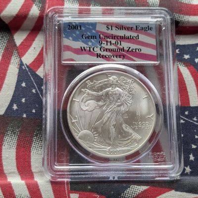 Sale Photo Thumbnail #252: 2001 American Silver Eagle 1 Troy Oz. .999 Silver - PCGS GEM UNC - WTC Ground Zero Recovery