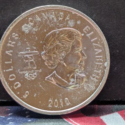 Sale Photo Thumbnail #446: 1 oz. .9999 FINE SILVER 2010 Canadian $5 Olympic Hockey Round