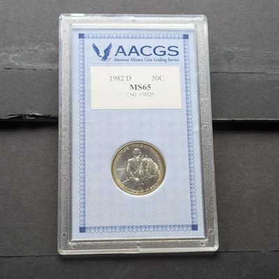 Sale Photo Thumbnail #216: 1982-D George Washington 90% Silver Commemorative Half Dollar - AACGS Cert. MS65