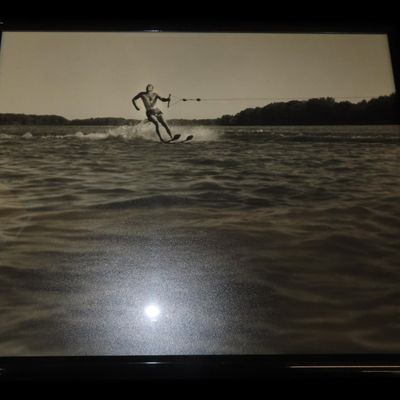 Sale Photo Thumbnail #393: 17" x 20" Framed Artwork Depicting a Man Skiing