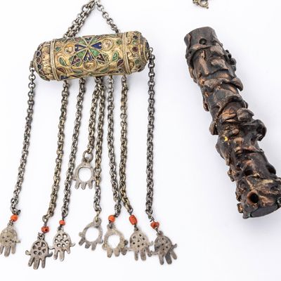 AN AMULET HOLDER AND A MEZUZAH CASE