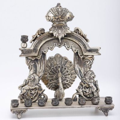 A SILVERPLATED PEACOCK FORM HANUKKAH LAMP. Austria, c. 1900