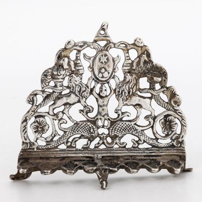 A MINIATURE SILVER HANUKKAH LAMP. Probably Dutch, 1920s. In the shape of an early Italian model. 3.2