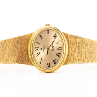 AN 18K GOLD LADIES WATCH BY UNIVERSAL GENEVE
