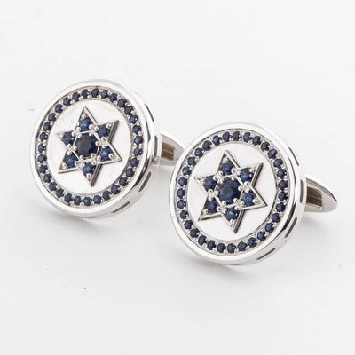 A PAIR OF 14k WHITE GOLD AND SAPHIRE CUFFLINKS - JEWISH STAR.