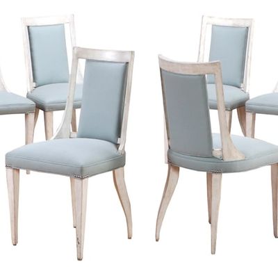 EIGHT PAINTED DINING CHAIRS WITH GRACEFUL LINES HAVING UPHOLSTERED SEATS AND BACKS.