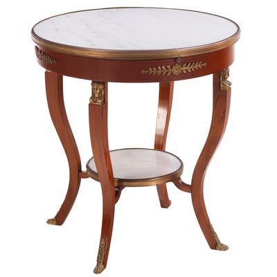 Sale Photo Thumbnail #210: A ROUND FRENCH EMPIRE BRONZE MOUNTED OCCASIONAL TABLE HAVING TWO TIERS OF WHITE MARBLE BOUND IN