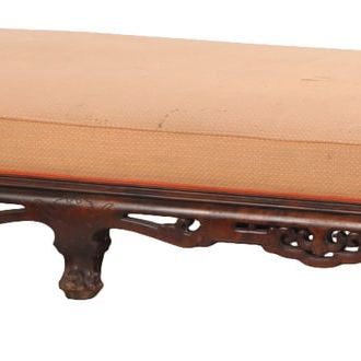 A FRENCH UPHOLSTERED AND CARVED HARDWOOD WINDOW BENCH IN THE MANNER OF GABRIEL VIARDOT CIRCA 1880.
