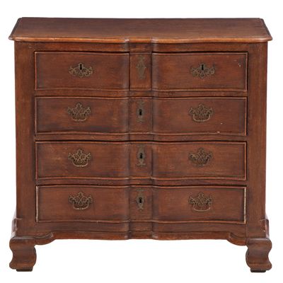 Sale Photo Thumbnail #259: A 19TH CENTURY FRENCH OAK COMMODE WITH SERPENTINE FRONT AND BRASS HANDLES.