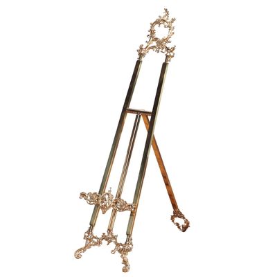 Sale Photo Thumbnail #264: A TALL AMERICAN VICTORIAN STYLE BRASS ARTIST EASEL HAVING ELABORATE SCROLL FORM DECORATION.